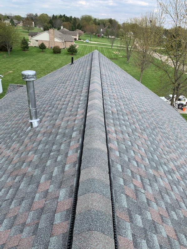 Image showing a newly installed residential roof. You can see the roof from  above with a view of a residential area in Huber Heights.
